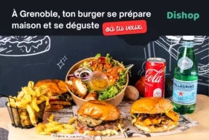 Burger à emporter à Grenoble avec frites maison, salade fraîche, Coca-Cola et eau pétillante, préparé artisanalement.