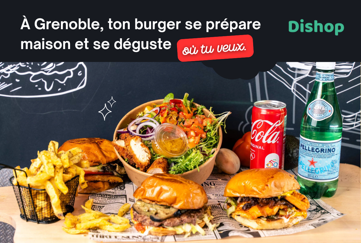 Burger à emporter à Grenoble avec frites maison, salade fraîche, Coca-Cola et eau pétillante, préparé artisanalement.